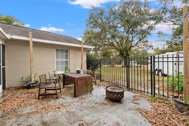 view of patio / terrace with an outdoor fire pit