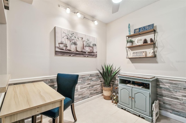 tiled home office with ceiling fan