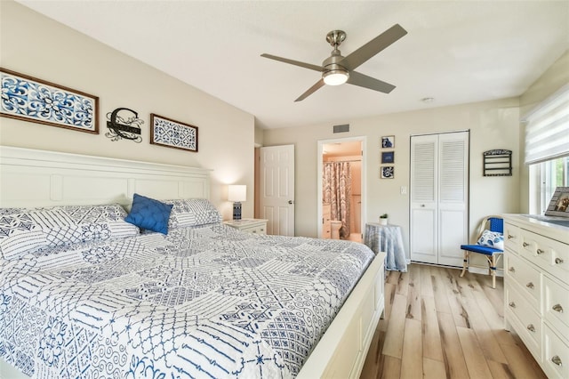 bedroom with ceiling fan, a closet, and light hardwood / wood-style flooring