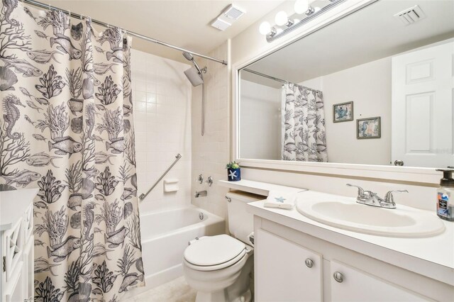 full bathroom featuring vanity, shower / bath combination with curtain, and toilet