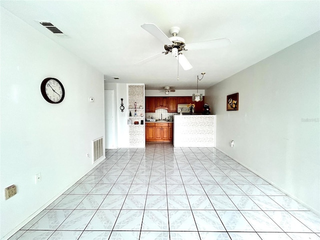 unfurnished living room featuring ceiling fan