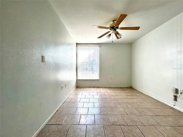 spare room with ceiling fan