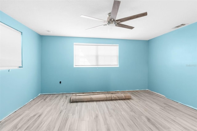 unfurnished room featuring light hardwood / wood-style flooring and ceiling fan