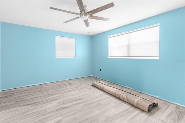 unfurnished bedroom featuring ceiling fan and light wood-type flooring