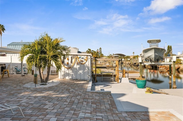 exterior space with a water view and a boat dock