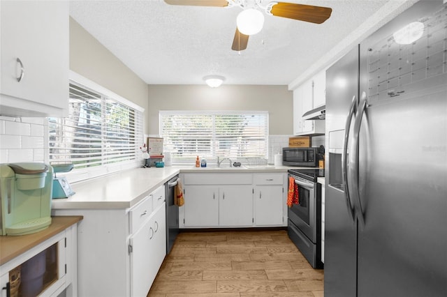 kitchen with white cabinetry, tasteful backsplash, and appliances with stainless steel finishes