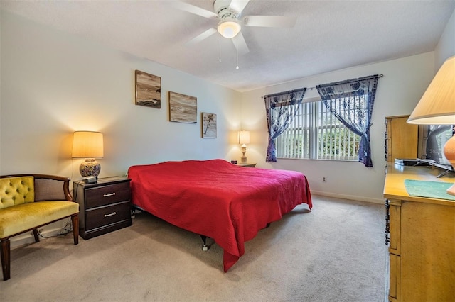 bedroom featuring ceiling fan and light colored carpet