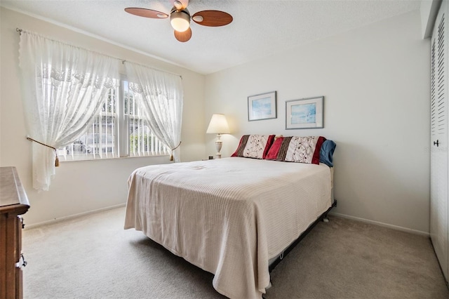 bedroom with carpet flooring, ceiling fan, and a closet