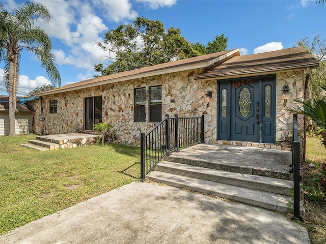 ranch-style house with a front yard