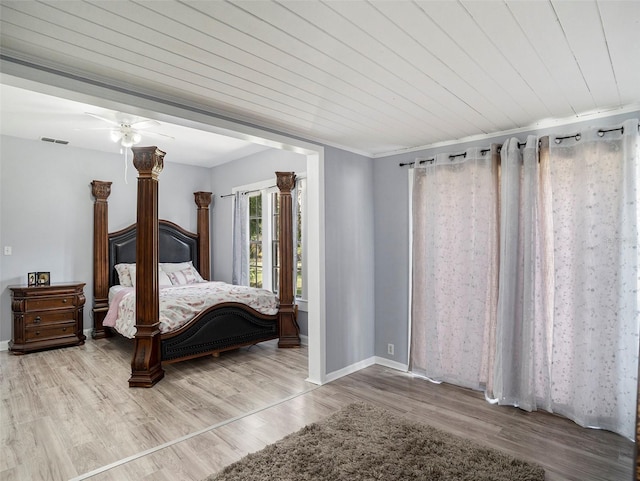 bedroom with hardwood / wood-style flooring, wooden ceiling, and crown molding