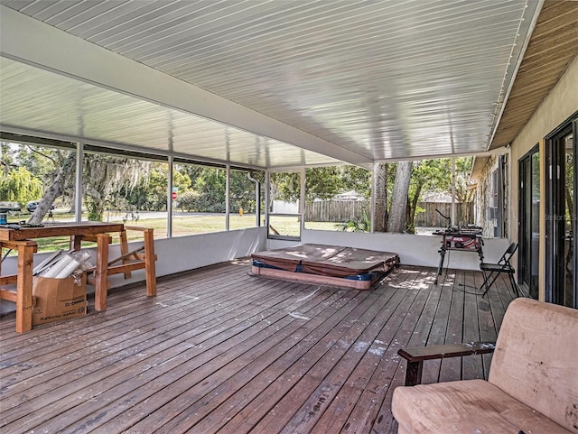 wooden deck featuring a covered hot tub