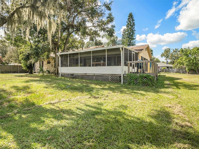 rear view of property with a yard