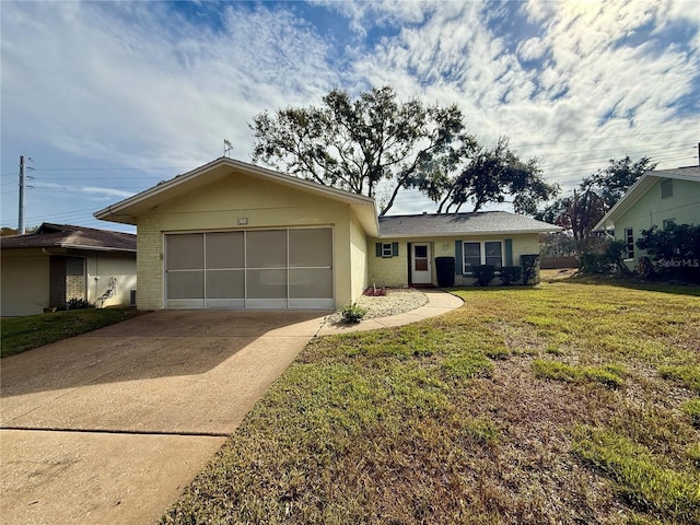 ranch-style home with brick siding, concrete driveway, a garage, and a front lawn