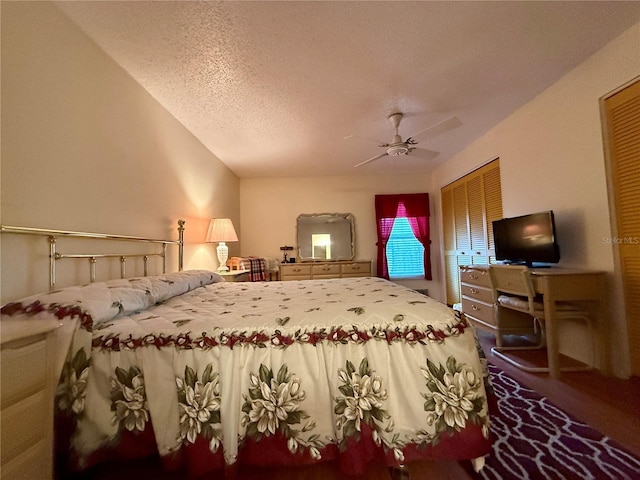 bedroom with ceiling fan, a closet, and a textured ceiling