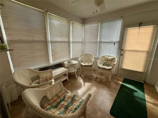 sunroom with ceiling fan