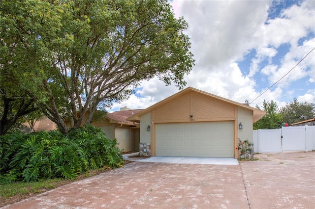 single story home with a garage