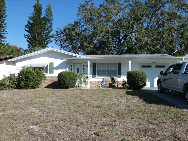 ranch-style home with a front yard and a garage