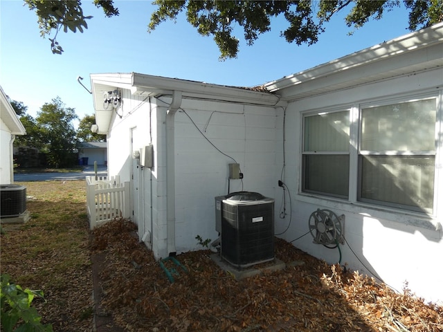 view of side of property featuring central AC unit