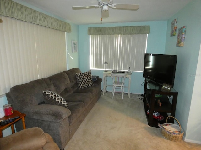 living room featuring ceiling fan and light colored carpet