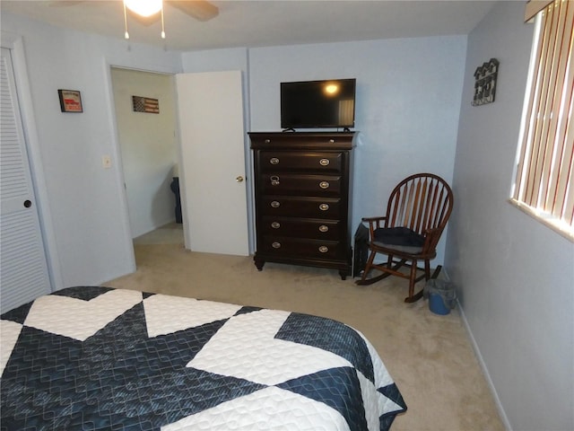 bedroom featuring ceiling fan and light colored carpet