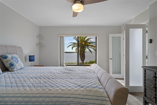 bedroom featuring ceiling fan and light hardwood / wood-style floors