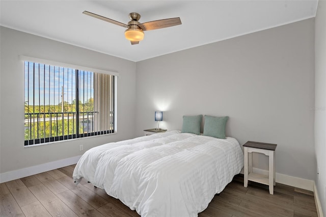 bedroom featuring dark hardwood / wood-style floors and ceiling fan