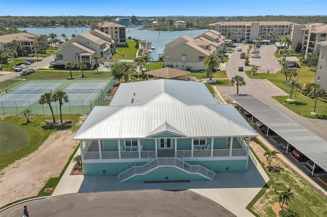 birds eye view of property featuring a water view