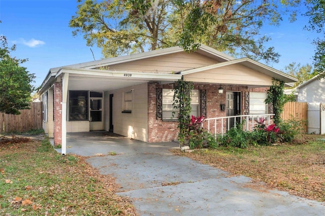 bungalow with a porch and a carport