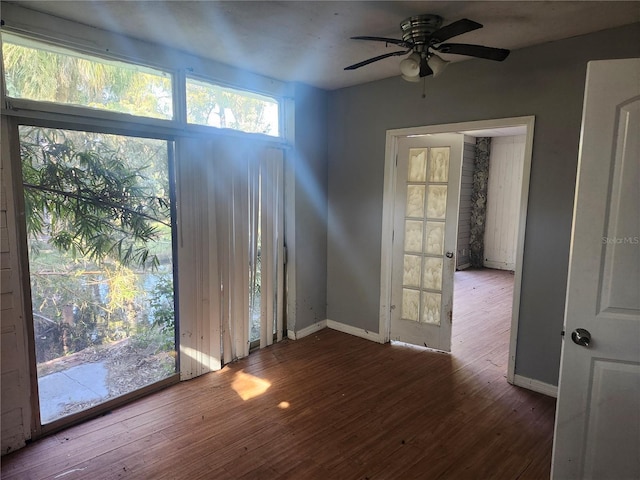 unfurnished room featuring ceiling fan and hardwood / wood-style floors