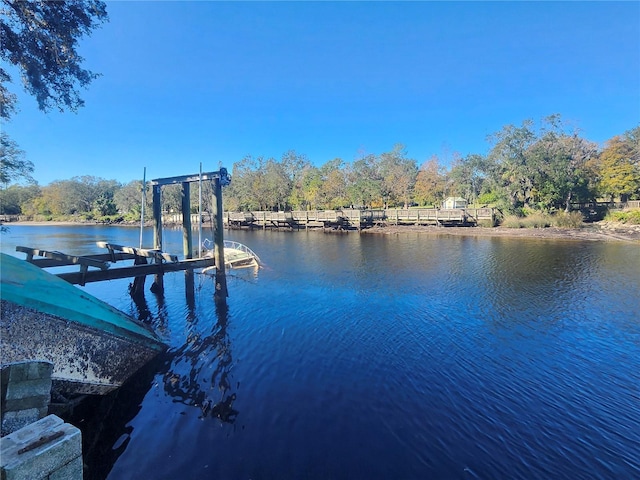 view of dock with a water view