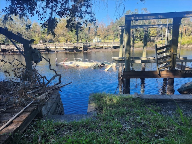 dock area featuring a water view