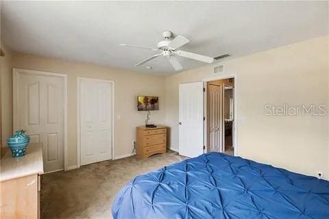 carpeted bedroom with ceiling fan