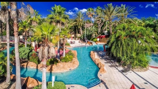 view of swimming pool featuring a water slide