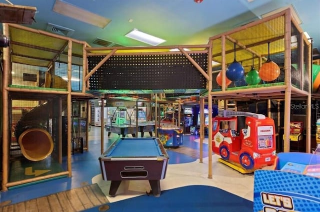 game room featuring concrete flooring and billiards