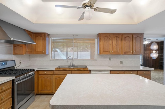 kitchen featuring gas stove, ventilation hood, ceiling fan, and sink