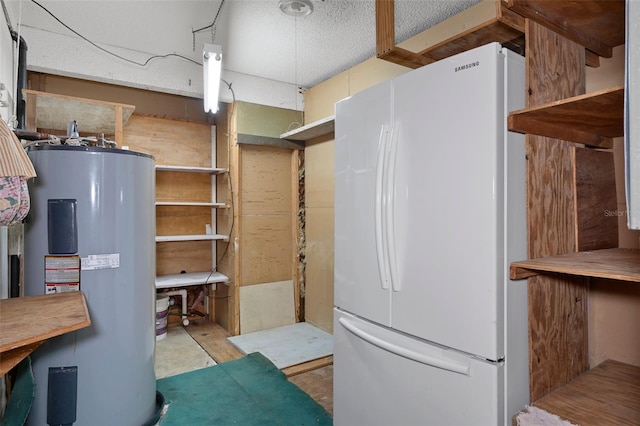 kitchen featuring white refrigerator and electric water heater