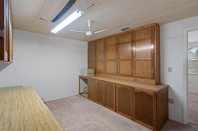 interior space featuring ceiling fan