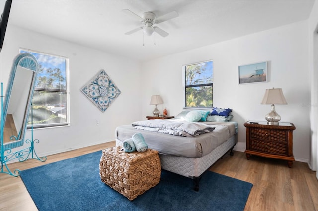 bedroom featuring ceiling fan and wood-type flooring