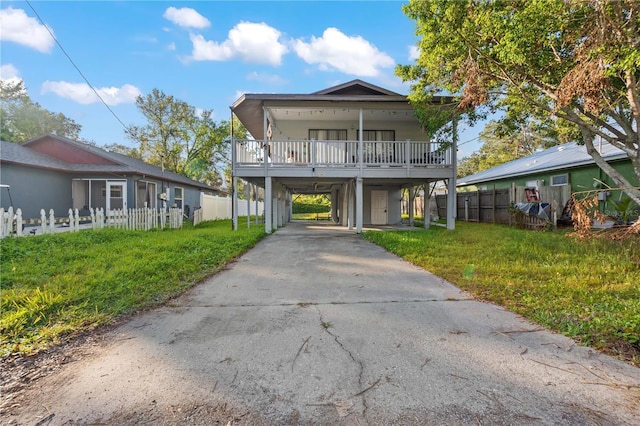 1244 31st Ave E, Bradenton, FL 34208 - view of front facade featuring a carport and driveway