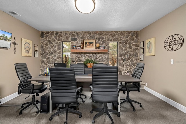 office area featuring carpet flooring and a textured ceiling