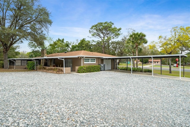 view of front of home featuring a carport