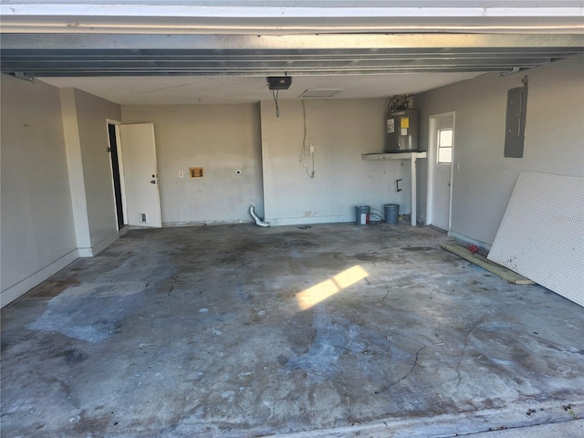 garage featuring electric water heater and electric panel