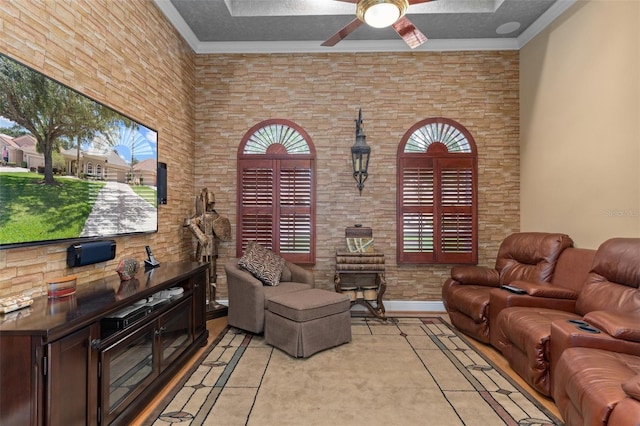 living room with a textured ceiling, crown molding, and a healthy amount of sunlight