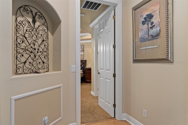 hallway featuring light carpet