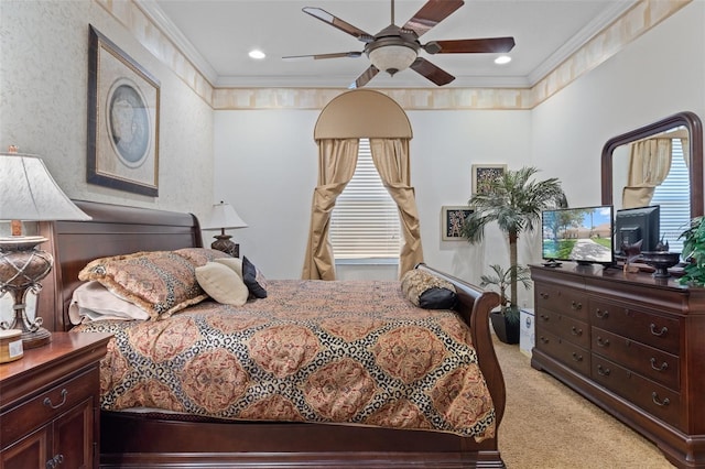 bedroom with light carpet, crown molding, and ceiling fan