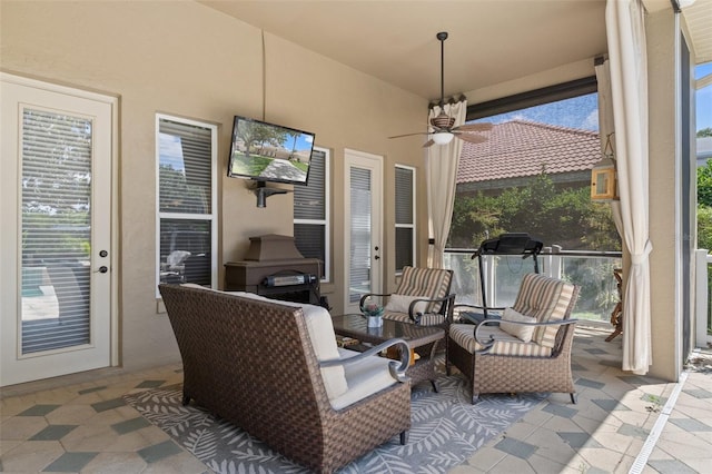 sunroom / solarium with ceiling fan