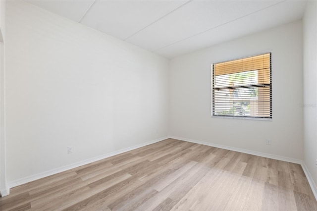 unfurnished room featuring light hardwood / wood-style floors