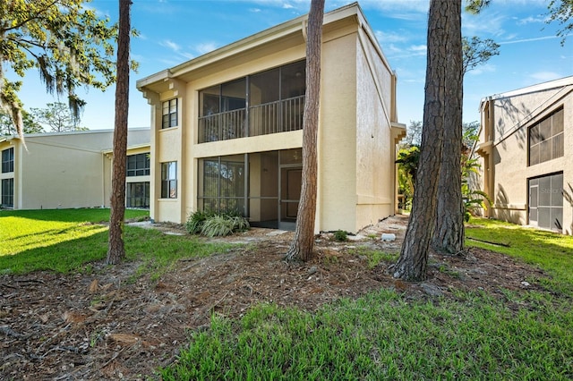 back of house with a yard