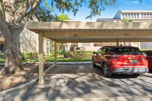 view of parking / parking lot with a carport