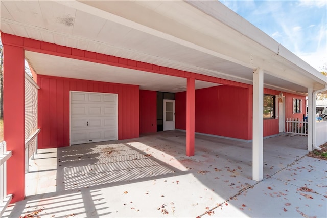 garage featuring a carport